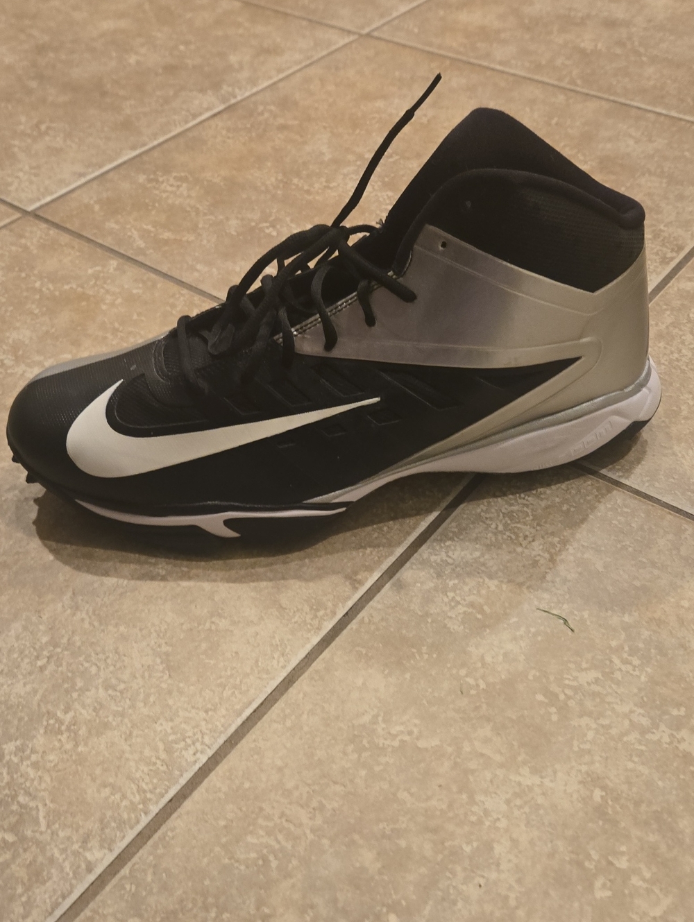 Nike Black and White Mid-Top Basketball Shoe with Silver Accents